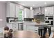 Modern kitchen with granite countertops, stainless steel appliances and a center island with seating at 5264 Veranda Dr, Noblesville, IN 46062