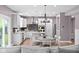 Open-concept kitchen with white cabinets, granite countertops, and stainless steel appliances at 5264 Veranda Dr, Noblesville, IN 46062