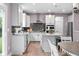 Stylish kitchen featuring white cabinets, granite counters, stainless steel appliances, and an island at 5264 Veranda Dr, Noblesville, IN 46062
