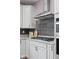 Kitchen features granite countertops, a gas cooktop with stainless steel hood, and a modern design at 5264 Veranda Dr, Noblesville, IN 46062