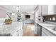 Open-concept kitchen flows into a living area featuring a dining space and comfortable seating at 5264 Veranda Dr, Noblesville, IN 46062