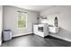Laundry room features modern appliances, a utility sink, storage and a window at 5264 Veranda Dr, Noblesville, IN 46062