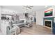 Spacious living room with a fireplace, open to the kitchen and dining area at 5264 Veranda Dr, Noblesville, IN 46062