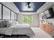 Main bedroom with a decorative ceiling features a bed with many pillows and a dresser at 5264 Veranda Dr, Noblesville, IN 46062