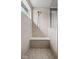 Tiled shower with a built-in seat, rainfall shower head, and hexagon tile flooring for a luxurious experience at 5264 Veranda Dr, Noblesville, IN 46062