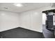 Unfinished basement area with painted floor offers customization potential at 5349 Culver St, Indianapolis, IN 46226