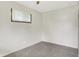 Cozy bedroom features neutral carpet and natural light from a large window at 5349 Culver St, Indianapolis, IN 46226