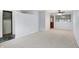 The living room offers a neutral carpet and paint to accommodate any decor with a view to the entry at 5349 Culver St, Indianapolis, IN 46226