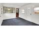 Sunroom with black floors, white walls, multiple doors and lots of windows at 5349 Culver St, Indianapolis, IN 46226