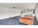 Spacious sunroom with hot tub and multiple windows for ample natural light at 5349 Culver St, Indianapolis, IN 46226