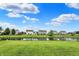 Beautiful backyard with a serene pond and a well-maintained lawn at 5598 W Woodstock Trl, McCordsville, IN 46055