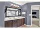Bathroom featuring a double sink vanity, television, and walk-in shower at 5598 W Woodstock Trl, McCordsville, IN 46055