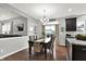 Dining area with dark wood table, seating for six, and sliding glass door to the backyard at 5598 W Woodstock Trl, McCordsville, IN 46055
