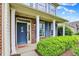 Inviting front porch with brick accents and a cheerful welcome mat at 5598 W Woodstock Trl, McCordsville, IN 46055