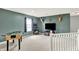 Upstairs bonus room with game table and TV, perfect for entertaining at 5598 W Woodstock Trl, McCordsville, IN 46055