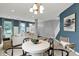 Open floor plan featuring a dining area, living room, and staircase at 5598 W Woodstock Trl, McCordsville, IN 46055