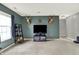 A recreation room featuring a large window, television, and unique mounted decor at 5598 W Woodstock Trl, McCordsville, IN 46055