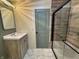 Tastefully updated bathroom with a gray-toned wood vanity and tile shower at 5861 N 330 W, Columbus, IN 47201