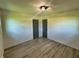Bright bedroom featuring wood-look floors, a closet and plenty of space at 5861 N 330 W, Columbus, IN 47201