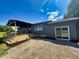 Charming home showcasing a spacious deck and sliding glass door entry at 5861 N 330 W, Columbus, IN 47201