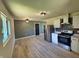Updated kitchen featuring stainless steel appliances, grey backsplash, and luxury flooring at 5861 N 330 W, Columbus, IN 47201