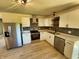 Modern kitchen with stainless steel appliances and bright white cabinetry at 5861 N 330 W, Columbus, IN 47201