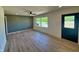 Open-concept living area with sleek floors, accent wall, and natural light at 5861 N 330 W, Columbus, IN 47201