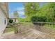Wooden back deck offers great outdoor living space with views of the private lawn and landscaping at 5939 Oberlies Way, Plainfield, IN 46168
