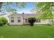 Large, grassy backyard with well-maintained lawn and a glimpse of the home's exterior, perfect for outdoor activities at 5939 Oberlies Way, Plainfield, IN 46168