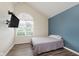 Well-lit bedroom featuring vaulted ceilings, wood flooring, and a large arched window for ample natural light at 5939 Oberlies Way, Plainfield, IN 46168
