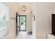 Bright entryway featuring neutral walls, tiled floors, and a coat rack for added convenience at 5939 Oberlies Way, Plainfield, IN 46168