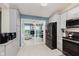 Well-equipped kitchen with granite counters and stainless appliances, adjacent to an open-concept living space and sunny study at 5939 Oberlies Way, Plainfield, IN 46168