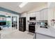 Modern kitchen featuring stainless steel appliances, tile backsplash, granite countertops, and lots of natural light at 5939 Oberlies Way, Plainfield, IN 46168