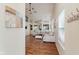 Open-concept living room with hardwood floors, comfortable seating, and stylish decor creating an inviting atmosphere at 5939 Oberlies Way, Plainfield, IN 46168