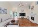 Comfortable living room featuring an open layout, fireplace, and stylish decor, creating an inviting and relaxed space at 5939 Oberlies Way, Plainfield, IN 46168