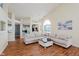 Spacious living room with hardwood floors, neutral walls, and an open layout, great for entertaining and relaxation at 5939 Oberlies Way, Plainfield, IN 46168
