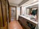 Modern bathroom with double sink vanity, stylish fixtures, and a walk-in shower at 6336 N Carroll Rd, Indianapolis, IN 46235
