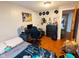 Bedroom with wood floors, gaming setup, and wall decor, providing a cozy and personalized space at 6336 N Carroll Rd, Indianapolis, IN 46235