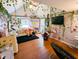 Comfortable bedroom with a vaulted ceiling, a ceiling fan, and natural light from the window at 6336 N Carroll Rd, Indianapolis, IN 46235