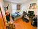 Nicely sized bedroom with wood floors, a comfy bed, desk area, and natural light from the window at 6336 N Carroll Rd, Indianapolis, IN 46235