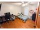 Comfortable bedroom with a twin bed, desk area, and bright window; perfect for relaxation and study at 6336 N Carroll Rd, Indianapolis, IN 46235