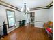 Traditional dining room with hardwood floors, wood trim, decorative chandelier and large window for natural light at 6336 N Carroll Rd, Indianapolis, IN 46235