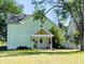 Charming home with a welcoming front porch and a well-manicured lawn at 6336 N Carroll Rd, Indianapolis, IN 46235