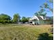 A view of the home, garage and large yard at 6336 N Carroll Rd, Indianapolis, IN 46235