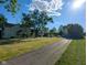 A view of the home, garage and large yard at 6336 N Carroll Rd, Indianapolis, IN 46235