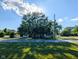 A well-maintained home with mature trees in front and a large front yard at 6336 N Carroll Rd, Indianapolis, IN 46235