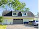 A garage with a door and two dormer windows above at 6336 N Carroll Rd, Indianapolis, IN 46235