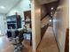 Hallway with a vaulted ceiling, carpet flooring, and natural light from the window at 6336 N Carroll Rd, Indianapolis, IN 46235
