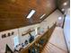 Hallway with skylights, fireplace, and wood details, offering a welcoming and visually appealing transition space at 6336 N Carroll Rd, Indianapolis, IN 46235
