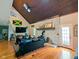 Cozy living room with a brick fireplace and hardwood floors at 6336 N Carroll Rd, Indianapolis, IN 46235